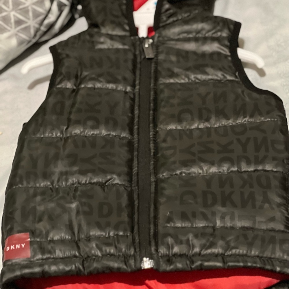 Size 24months Dkny vest new black with the red lining